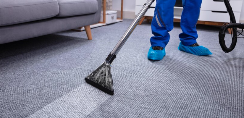 Neon Clean technician performing gutter cleaning at a business in Los Angeles, CA